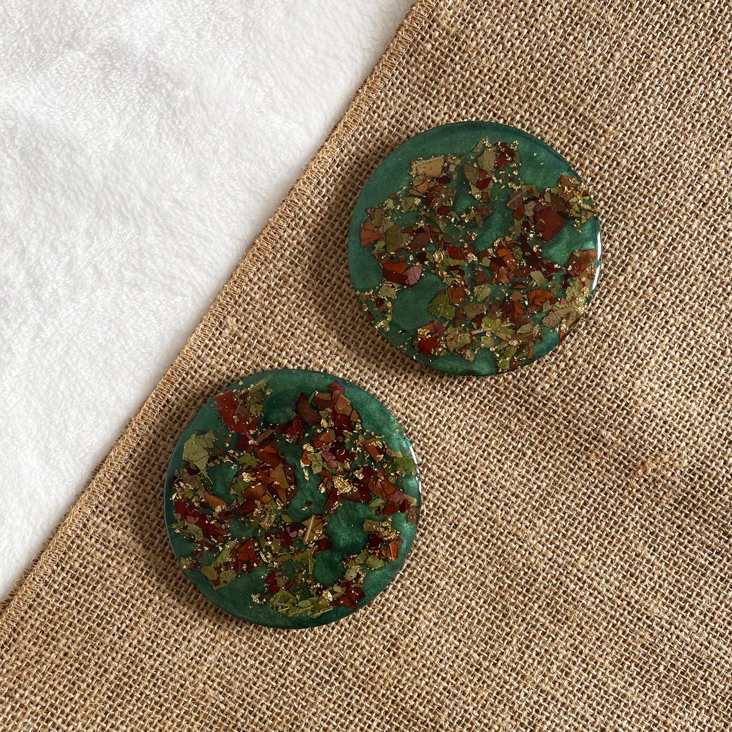Artisan resin coaster with teal base and rose petals, durable handmade table décor