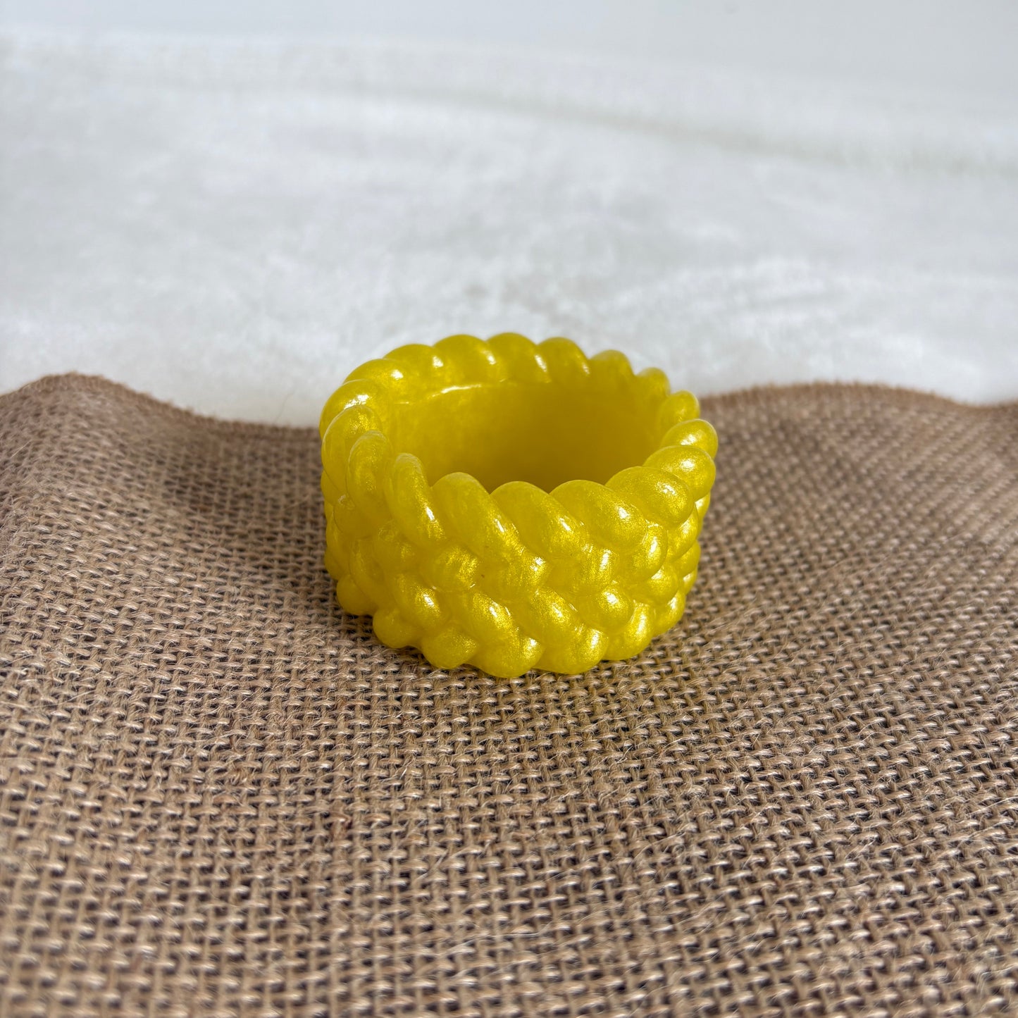 Yellow resin tealight holder with textured surface