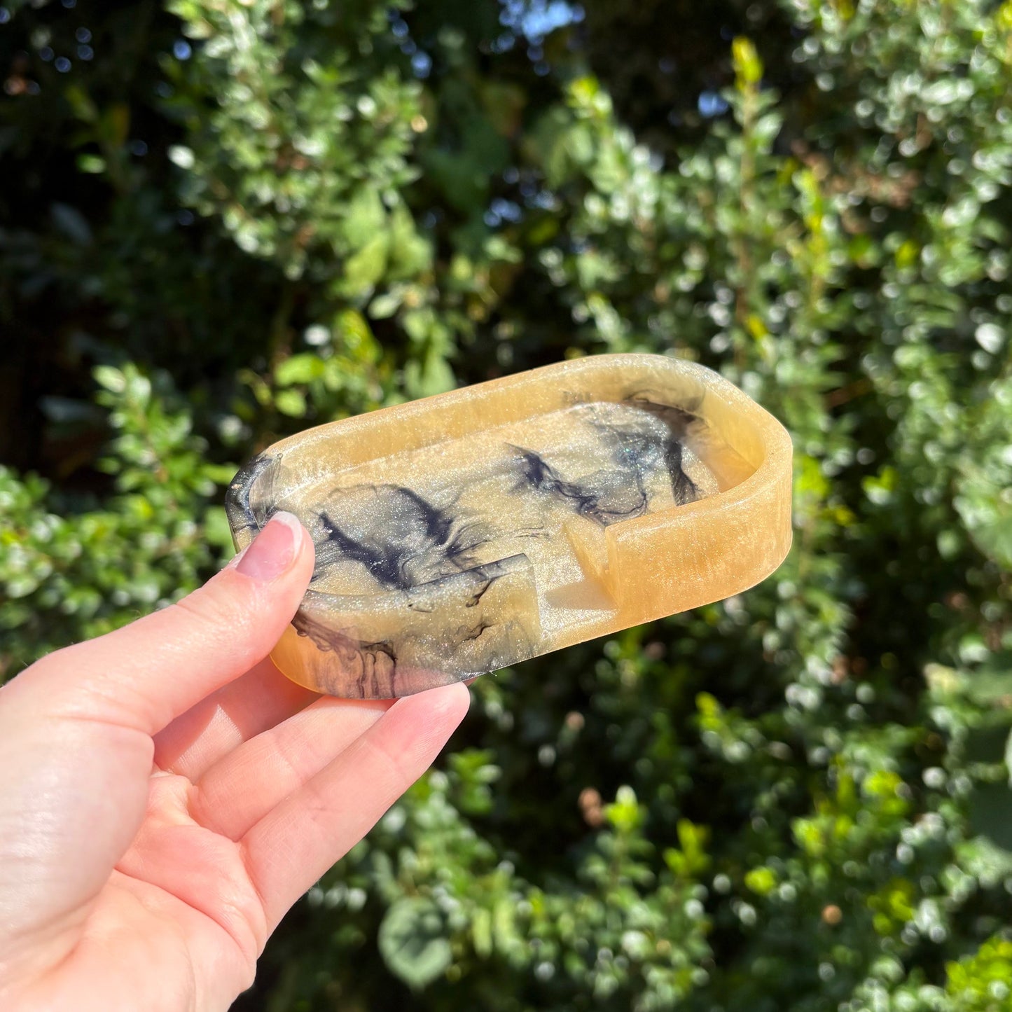 Black and beige resin soap dish with marble pattern