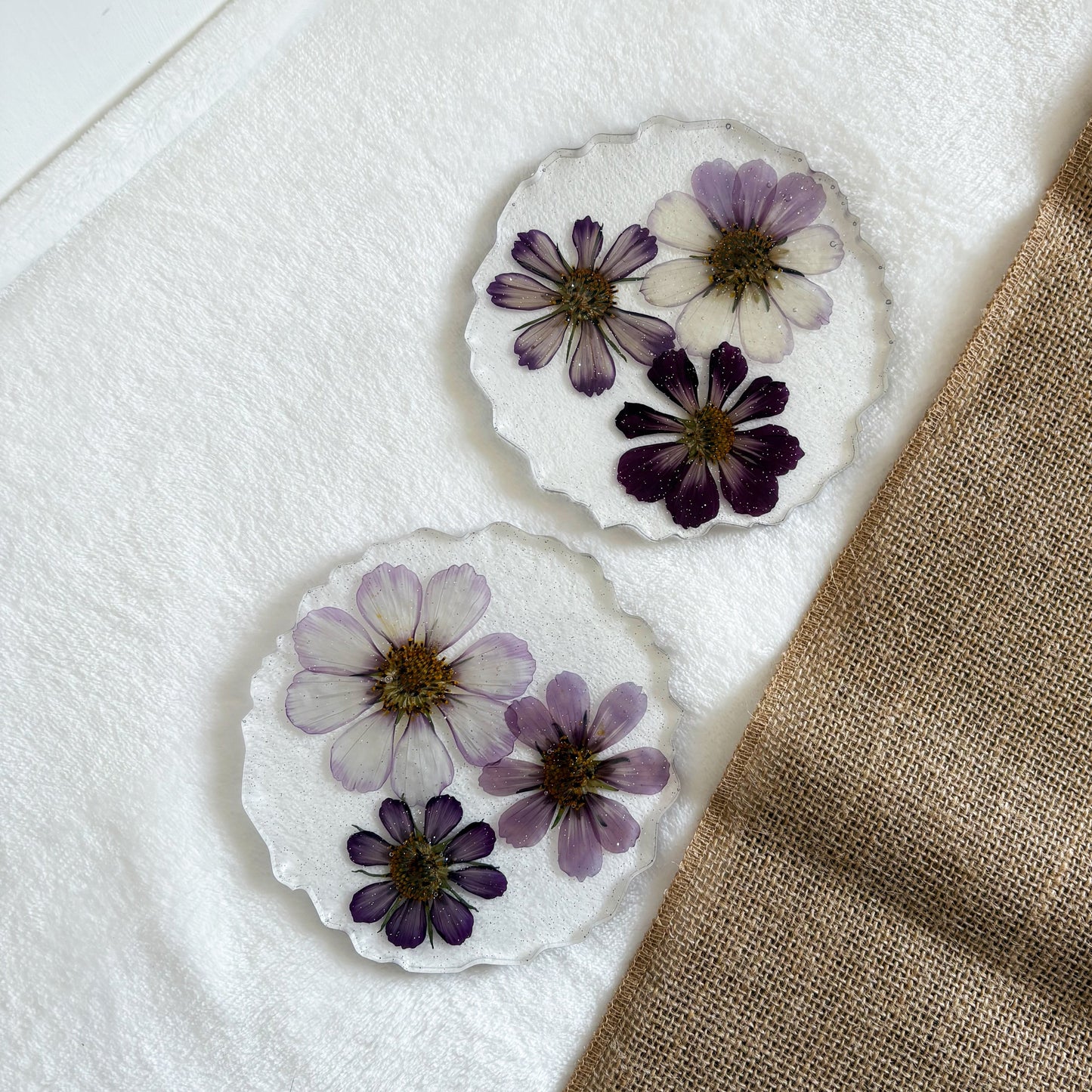 Handmade resin drink coaster with purple floral design, one-of-a-kind décor accent
