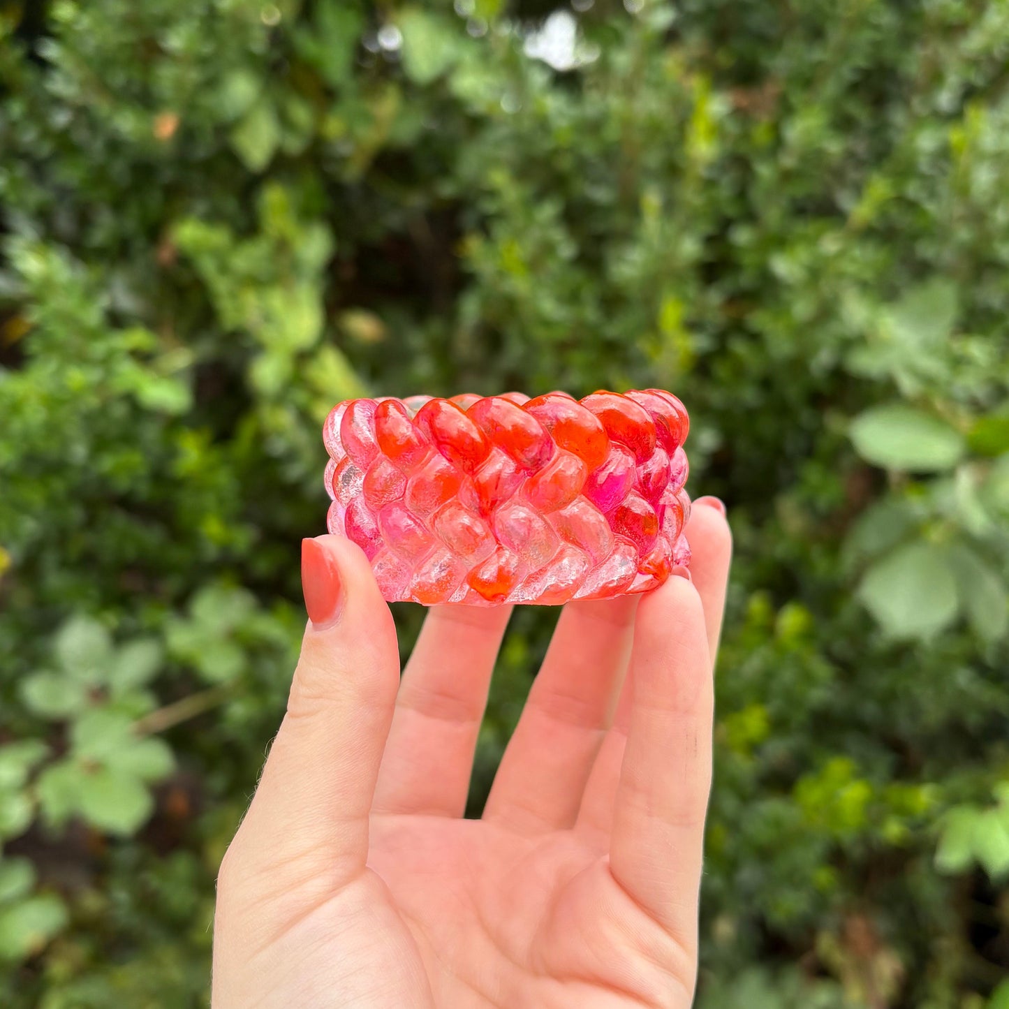 Textured handmade resin decorative pot in orange and pink