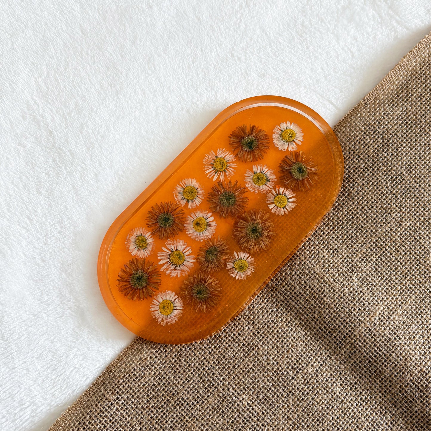 Orange resin jewellery tray with delicate floral accents