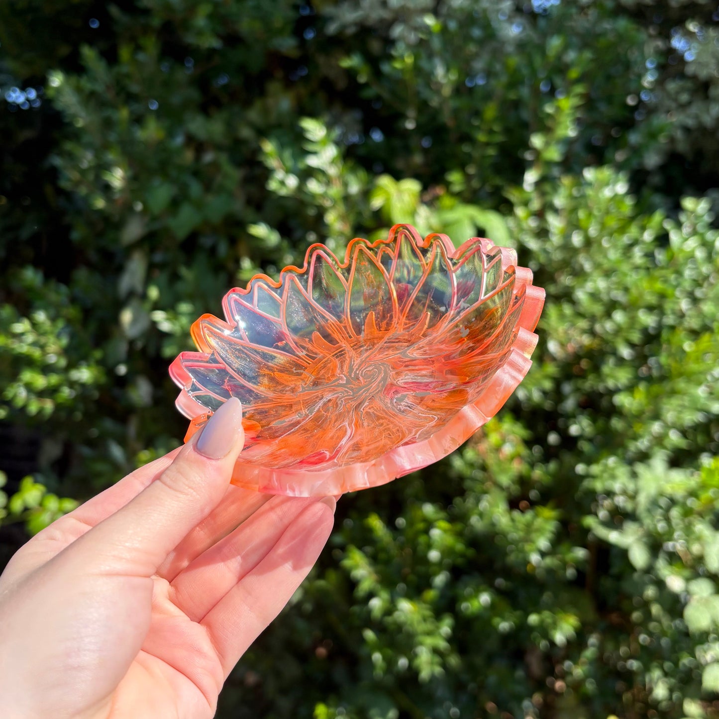 Handmade transparent resin dish with soft peach tones