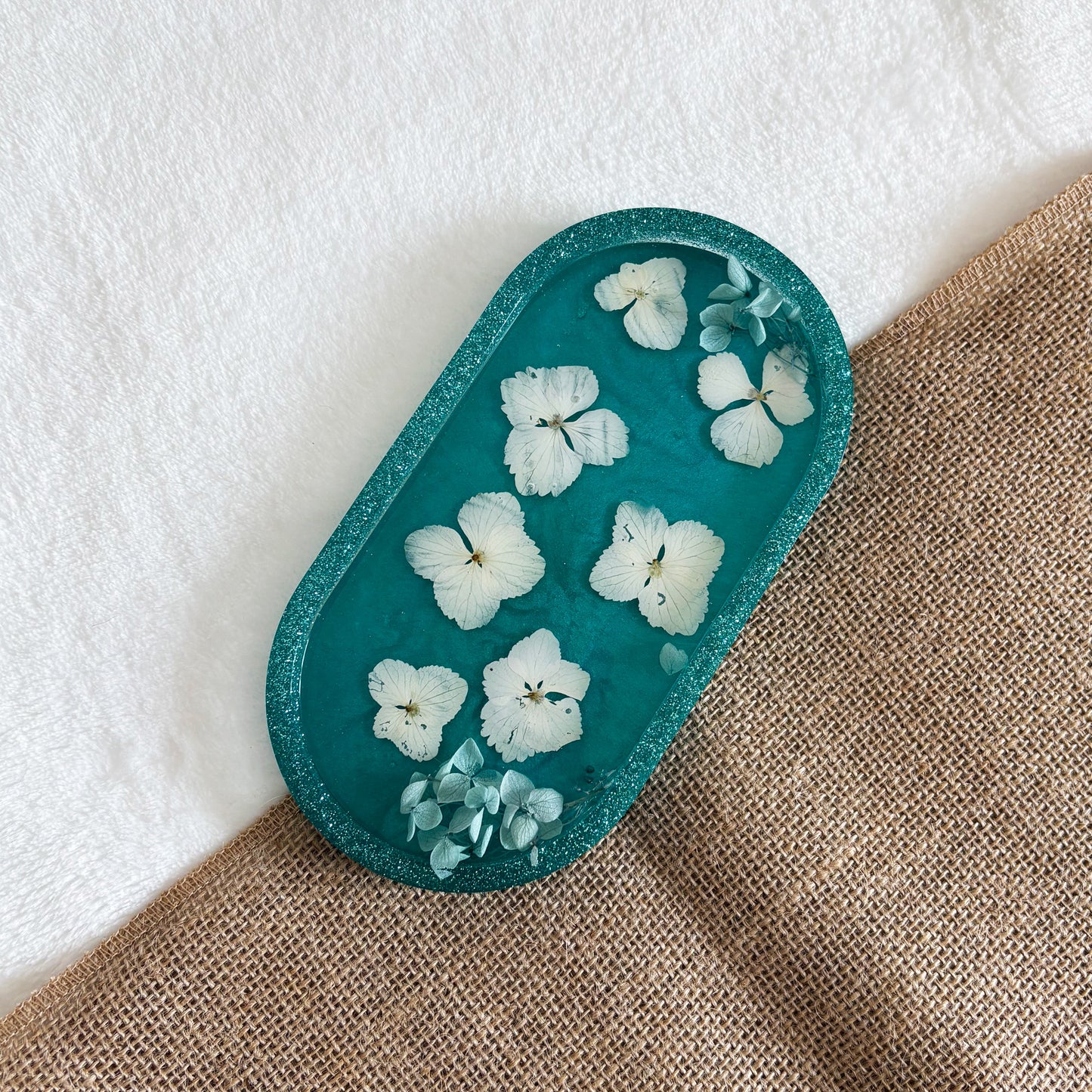 Teal resin jewellery tray with delicate white flowers