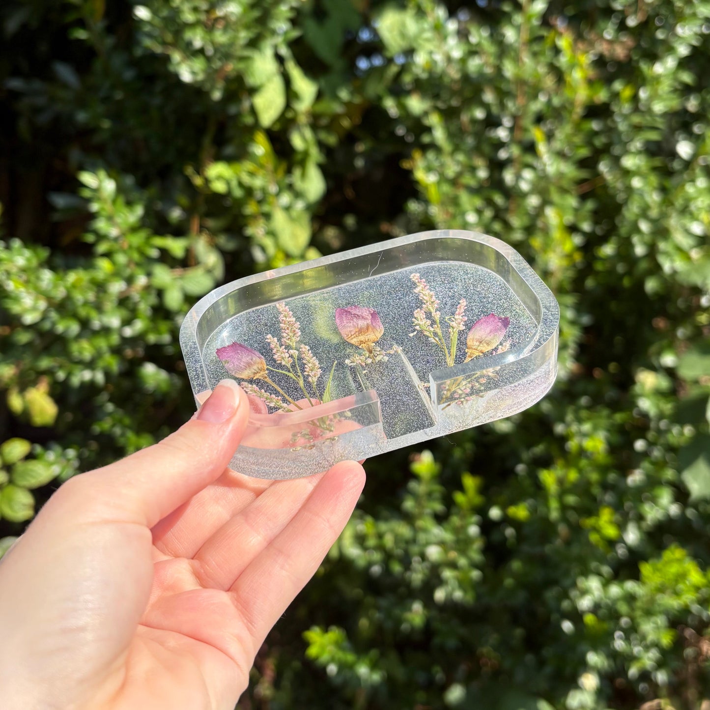 Clear resin soap dish with floral design and drainage holes
