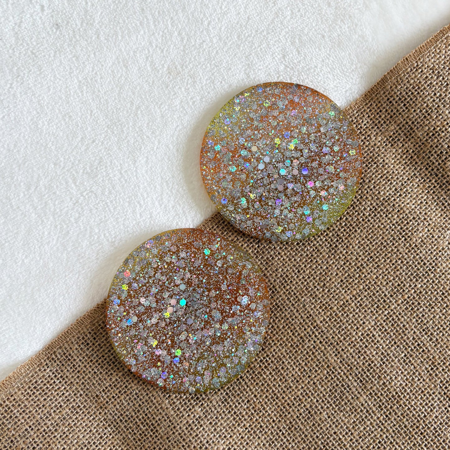Silver glitter resin coaster, yellow and orange tones, handmade round home accessory