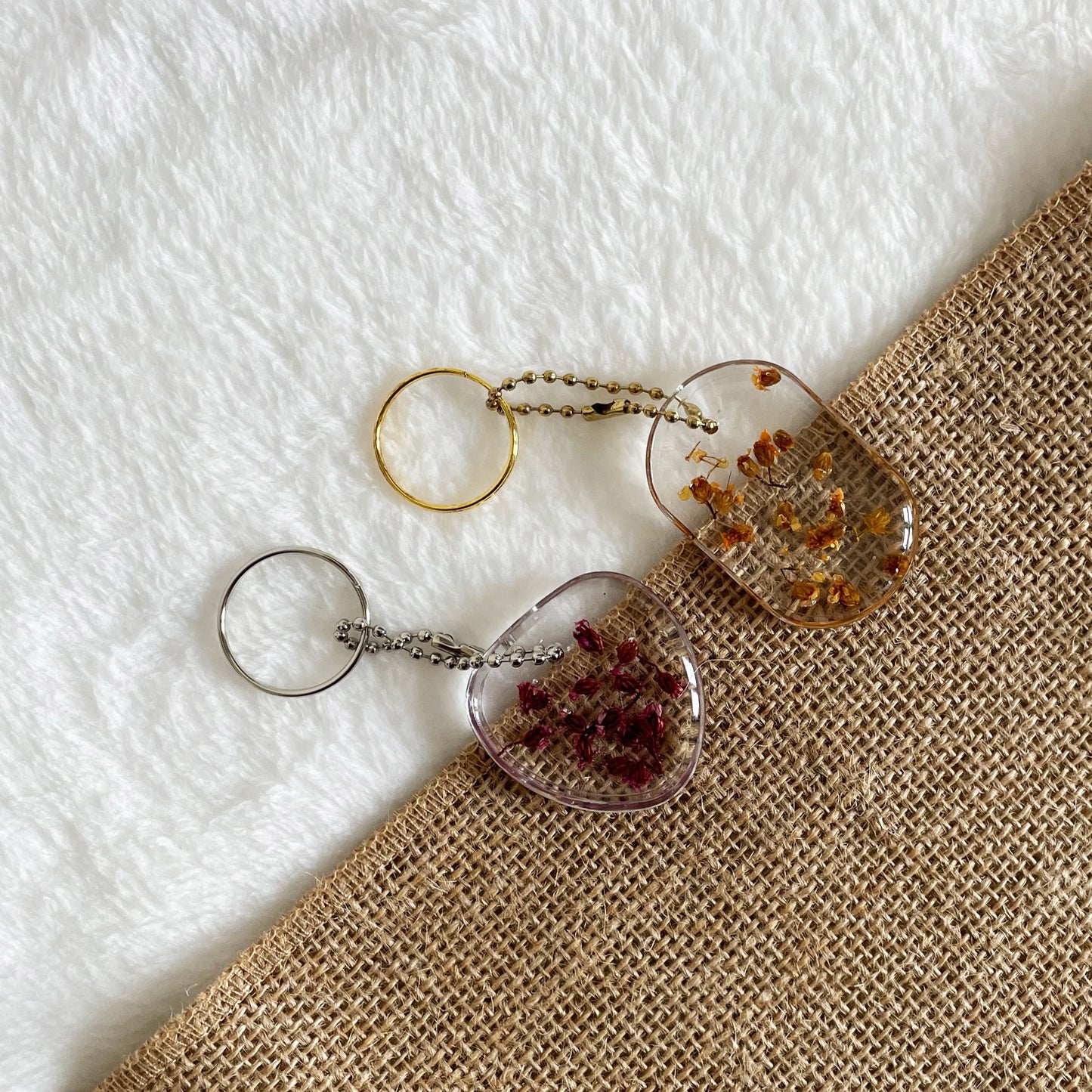 Oval transparent resin keyring with real flowers, handmade accessory