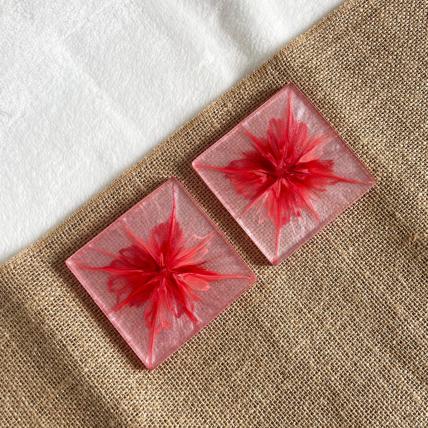 Close-up of pink marble resin coaster with swirled pattern and smooth surface – artisan handmade gift idea
