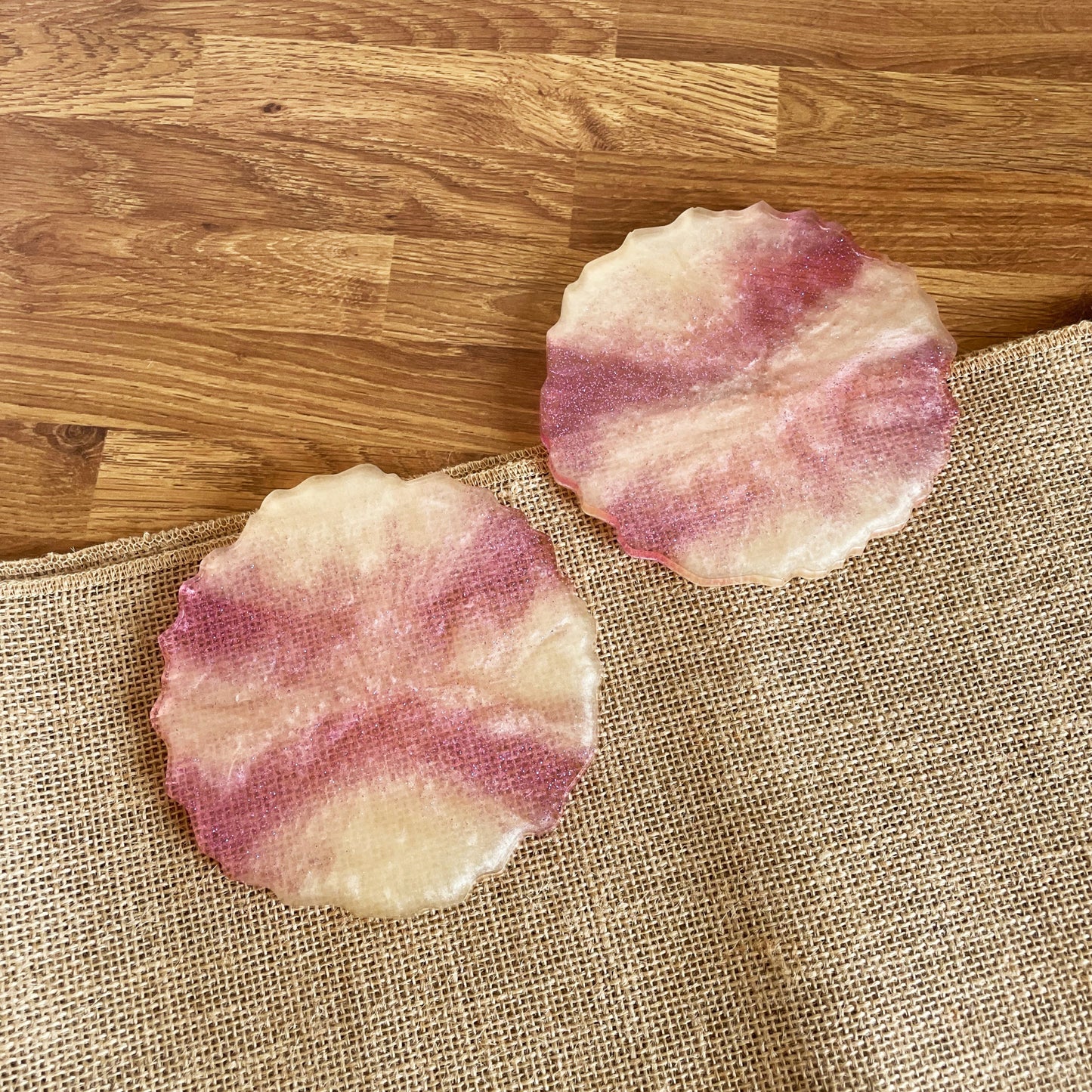Handmade resin drink coaster with pink and yellow marble swirl, unique handmade décor