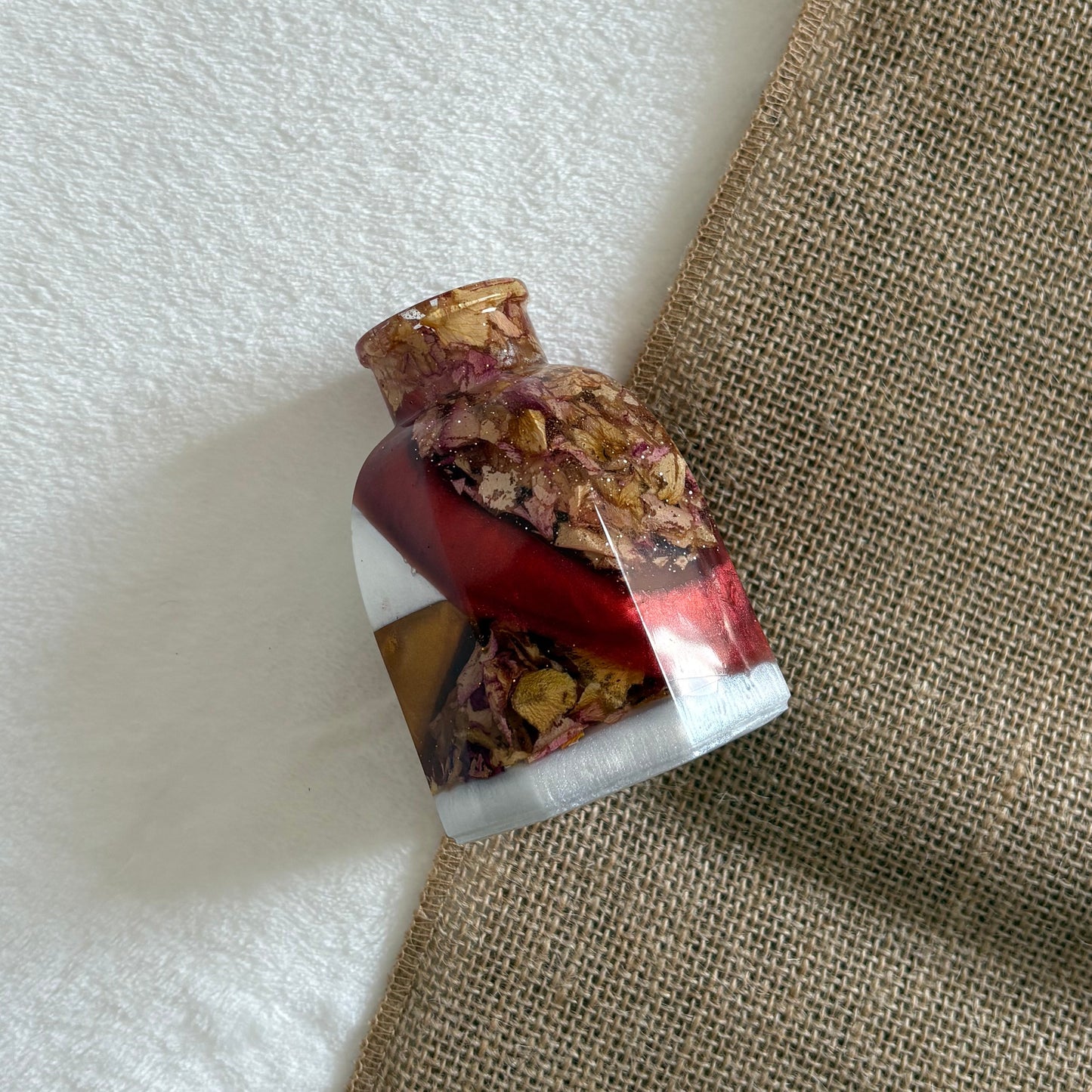 Glossy handmade resin vase with glitter accents