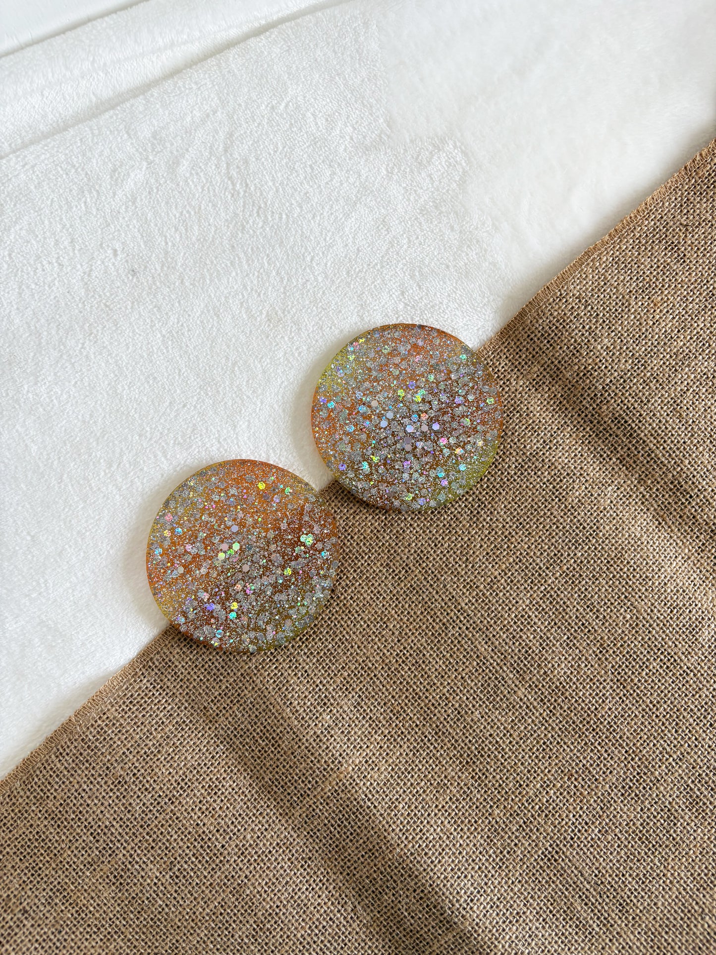 Handmade silver resin glitter coaster with yellow and orange base, round shape, handmade home décor
