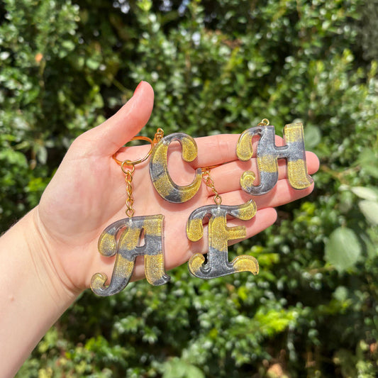 Black and gold marble resin letter keychain, handmade personalised gift