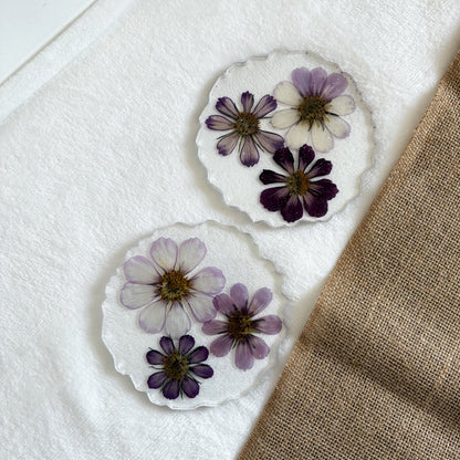 Handmade resin drink coaster with purple floral design, one-of-a-kind décor accent