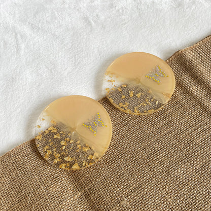 Handmade resin coaster with gold leaf detail, one-of-a-kind home décor piece