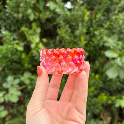 Textured handmade resin decorative pot in orange and pink