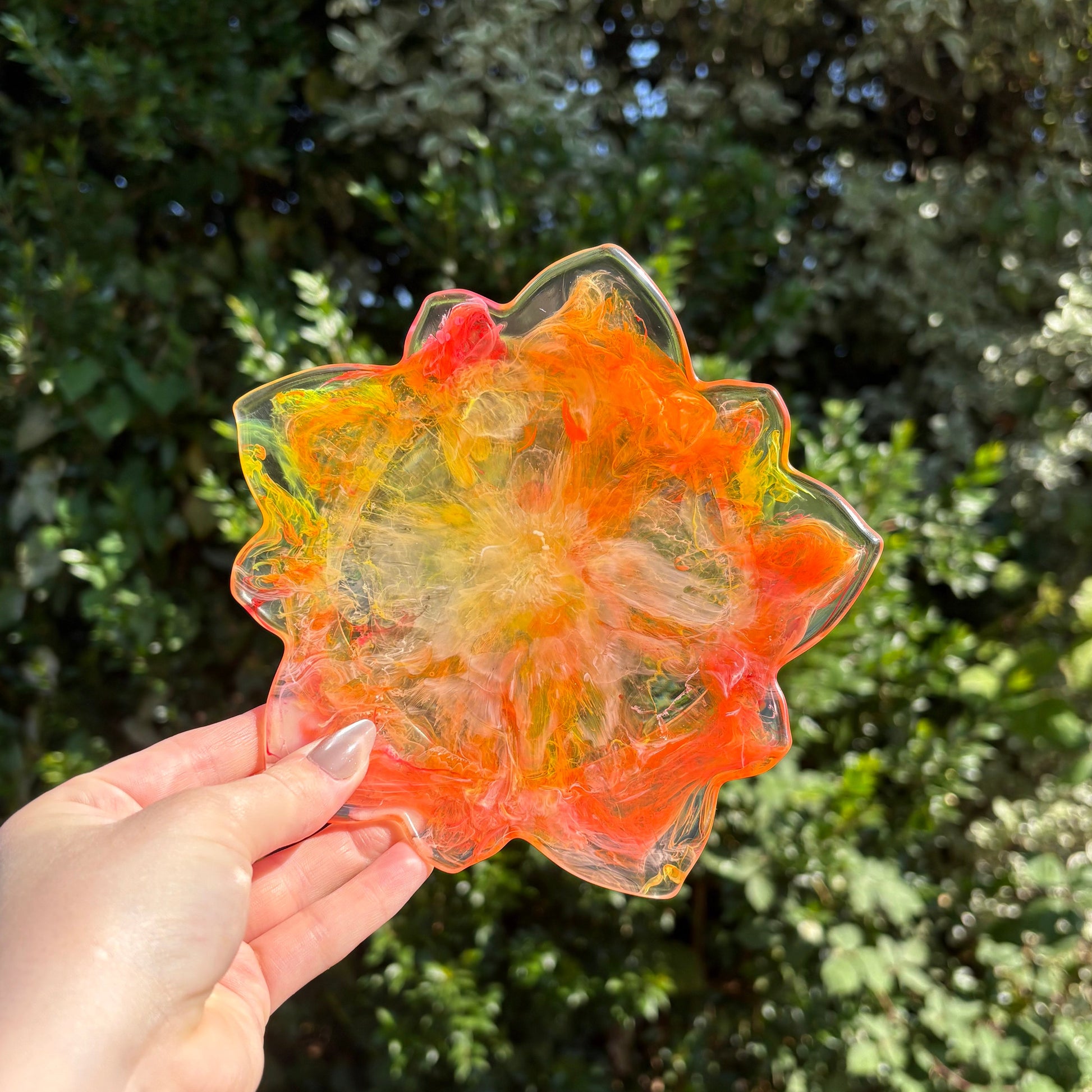 Handmade resin tealight holder with sunset marbling