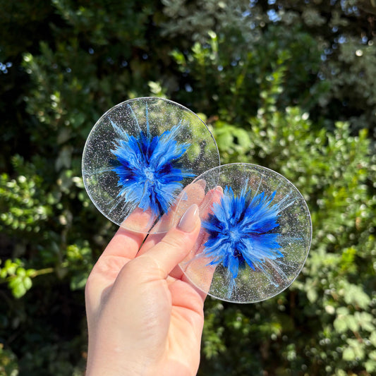 Handmade transparent resin coaster with blue marbling, round shape, unique handmade home décor