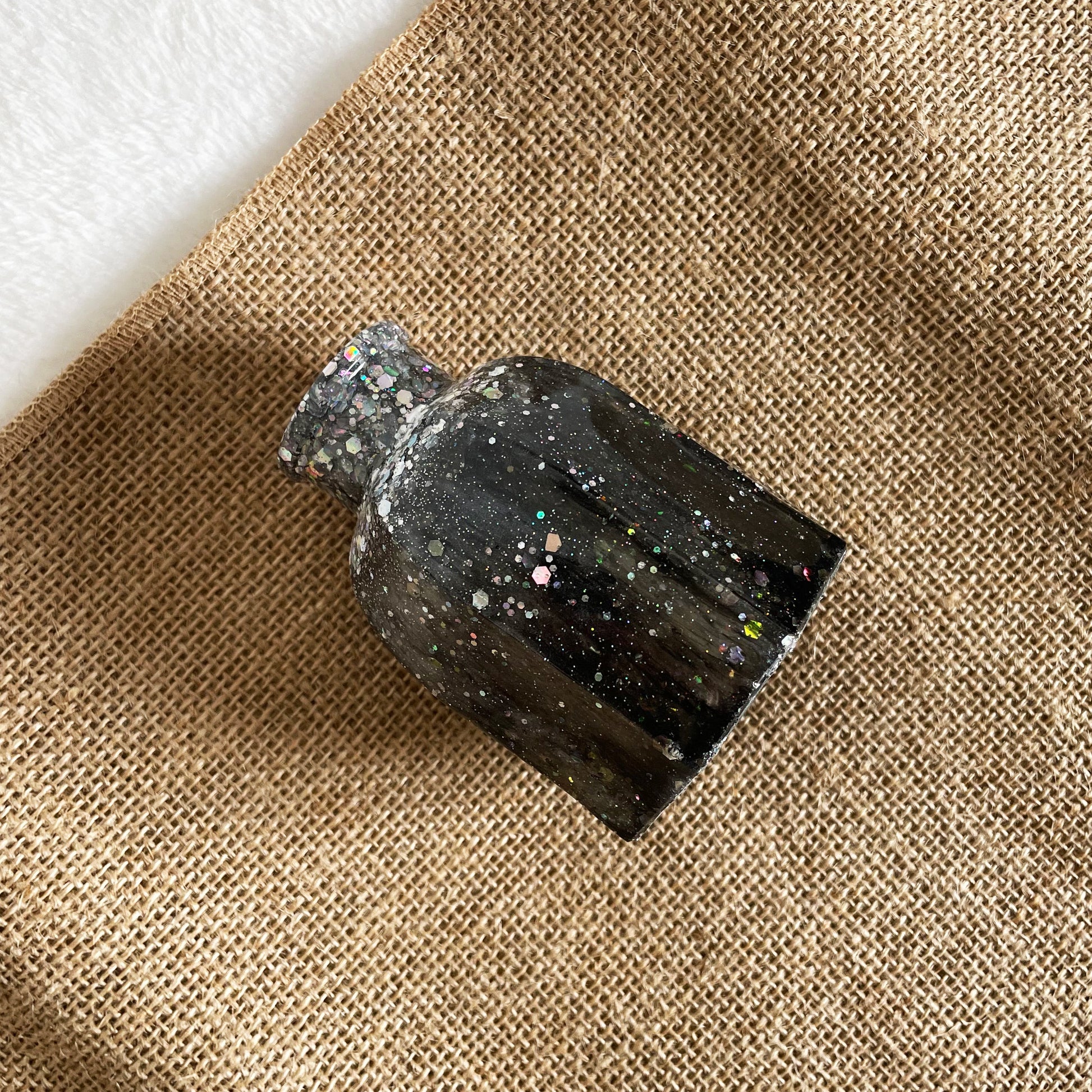 Rounded handmade resin vase with black and silver glitter