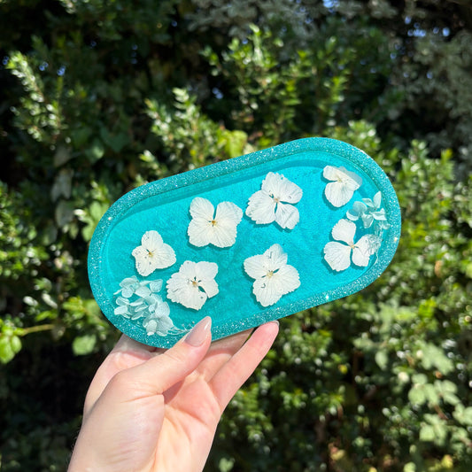 Handmade teal resin vanity tray with white floral inclusions