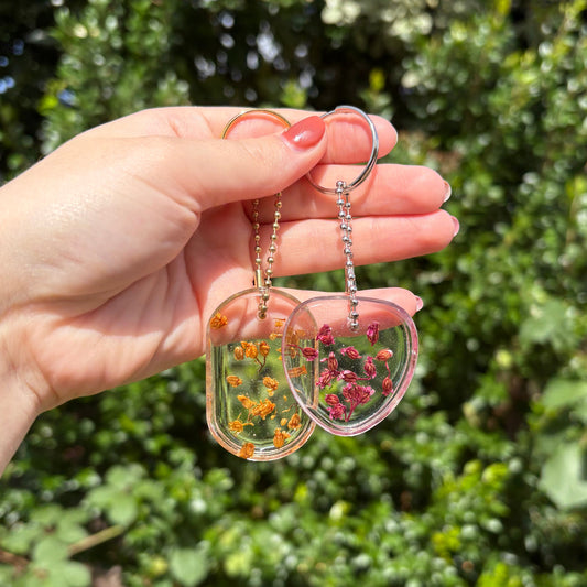Transparent floral handmade resin keyring in heart and oval shapes