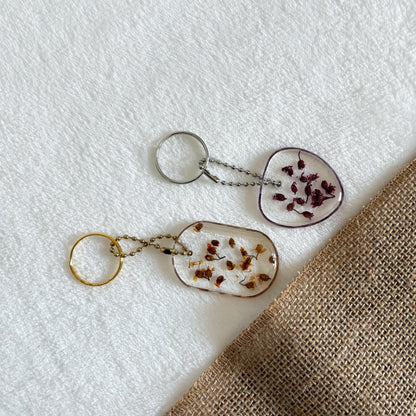 Heart shaped resin keyring with pressed flowers, handmade design