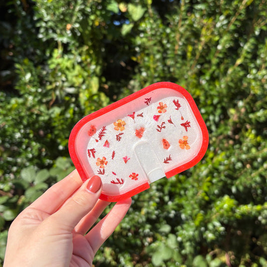 Handmade white resin soap dish with red edge and floral detailing